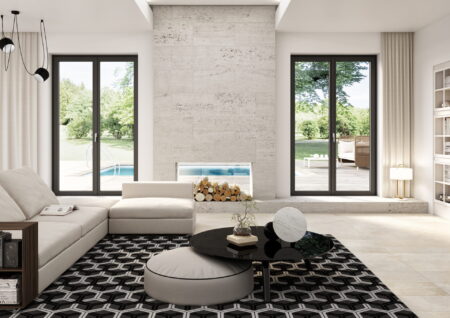 Balconeras de PVC gris en salón moderno con chimenea y vistas a jardín con piscina